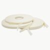closeup image of three white Scapa Double Coated Polyethylene Foam Tape: 1/16″ Thick x 1″ x 36 yd