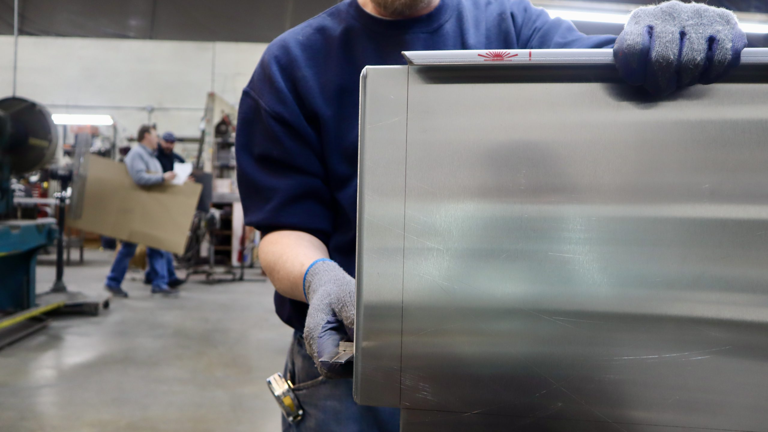Nessfab employee bending stainless steel